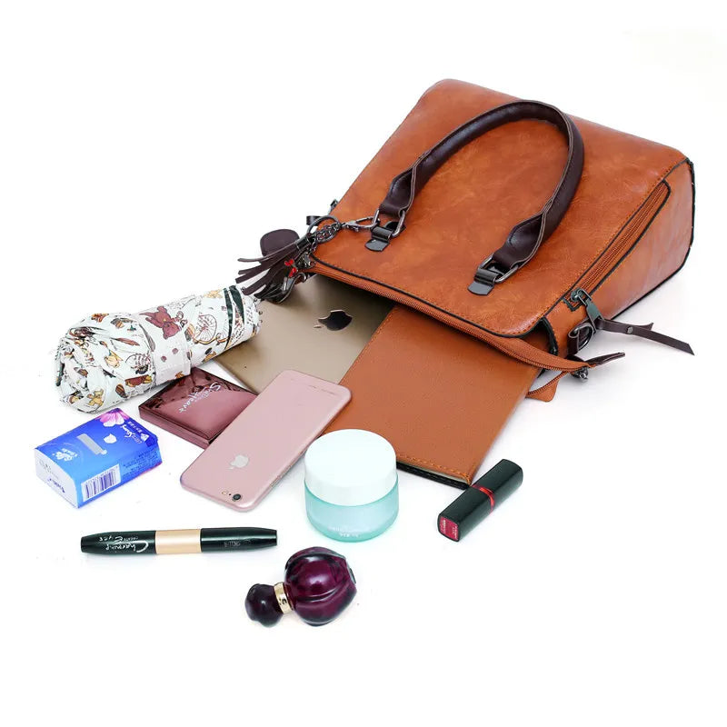 Kit Premium em Couro - Bolsa + Carteira + Carteira de Mão + Necessaire de Brinde